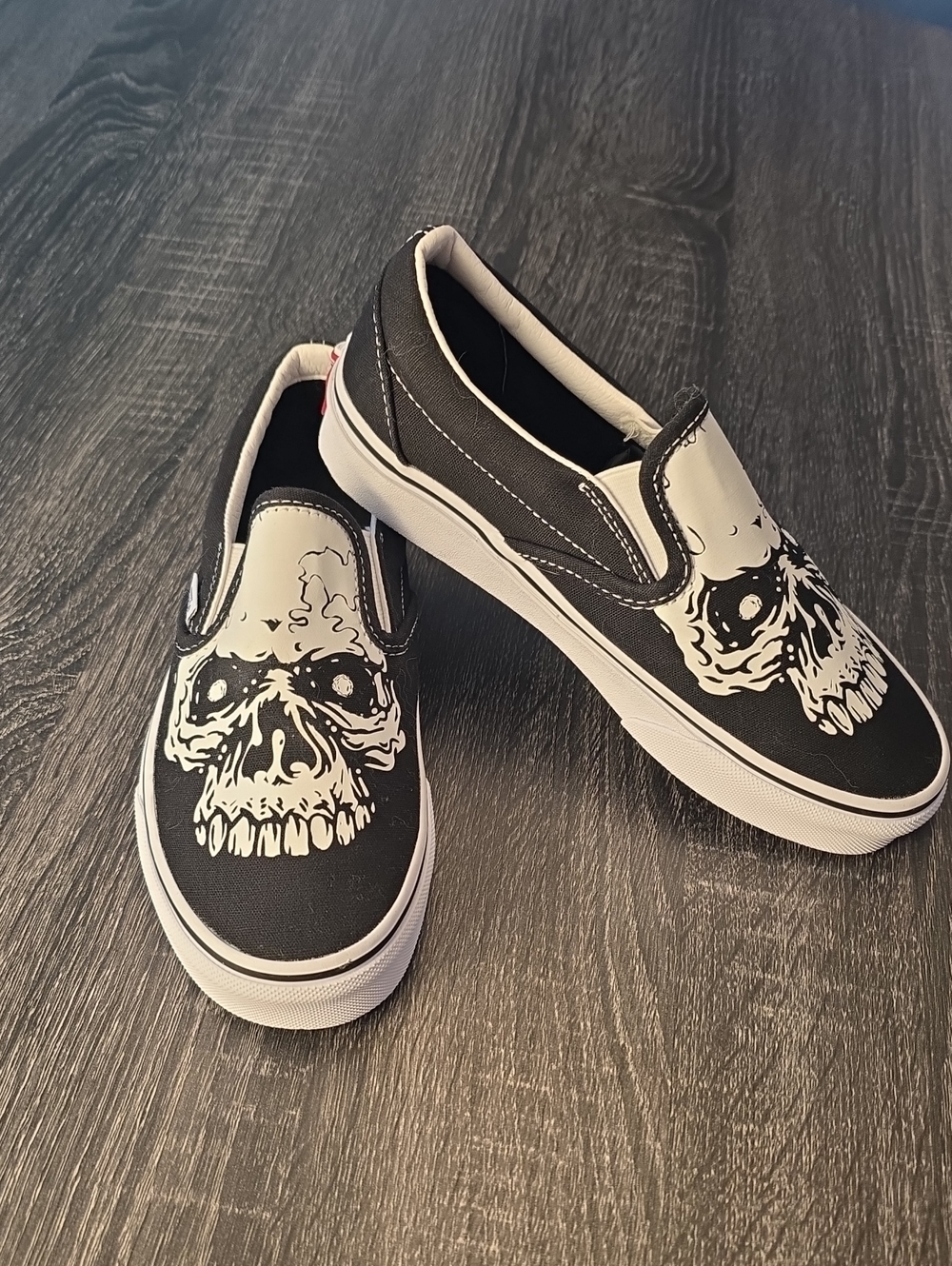 Vans Black and White Skull Slip-On Sneakers for Kids